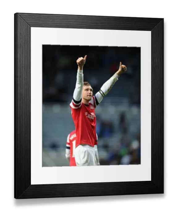 Framed Print : Per Mertesacker's Triumph: Arsenal Secures Victory Over Newcastle United in the 2013-14 Premier League