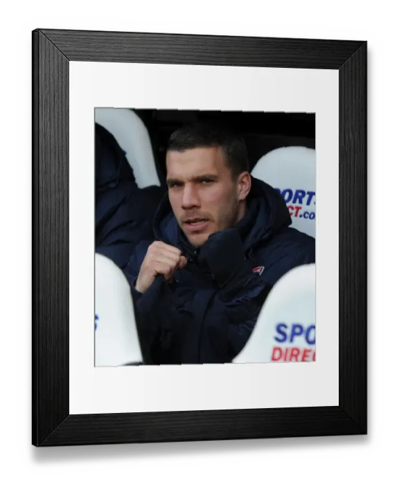 Framed Print : Lukas Podolski: Ready to Sub in Newcastle United vs Arsenal (2013-14) Framed Print : Lukas Podolski: Ready to Sub in Newcastle United vs Arsenal (2013-14)