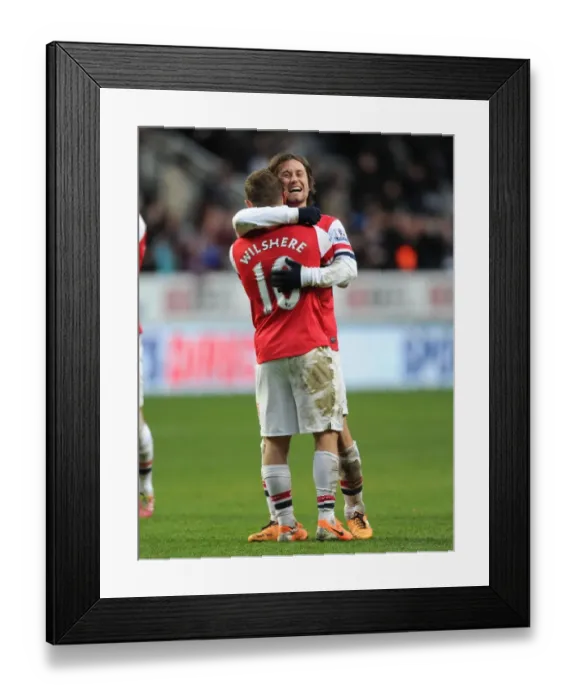 Framed Print : Celebrating Victory: Rosicky and Wilshere Rejoice after Arsenal's Win against Newcastle United (2013-14)