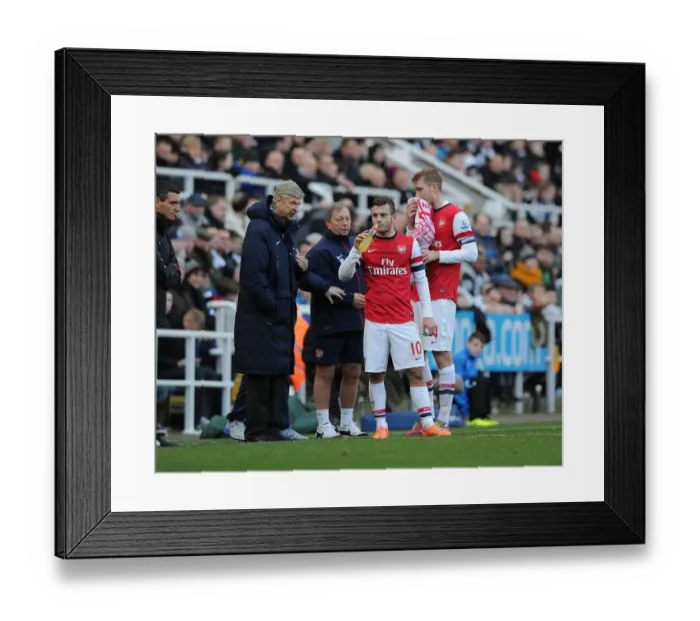 Framed Print : Arsene Wenger Conferring with Jack Wilshere and Per Mertesacker during Newcastle United vs Arsenal, Premier League 2013-14