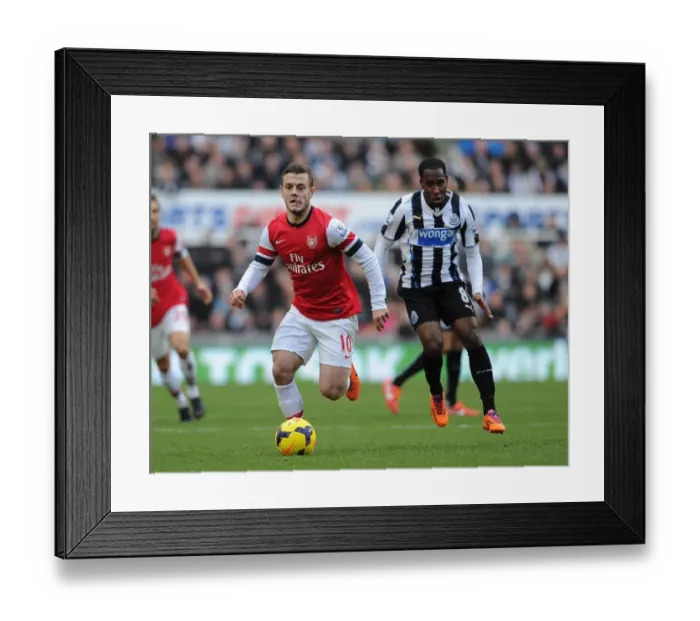 Framed Print : Jack Wilshere Outmaneuvers Moussa Sissoko: A Battle in the Midfield - Newcastle United vs Arsenal (2013-14)