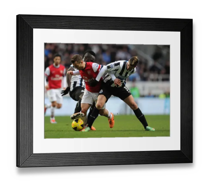 Framed Print : Jack Wilshere vs. Mathieu Debuchy: Intense Rivalry in Newcastle United vs. Arsenal Football Clash (2013-14)