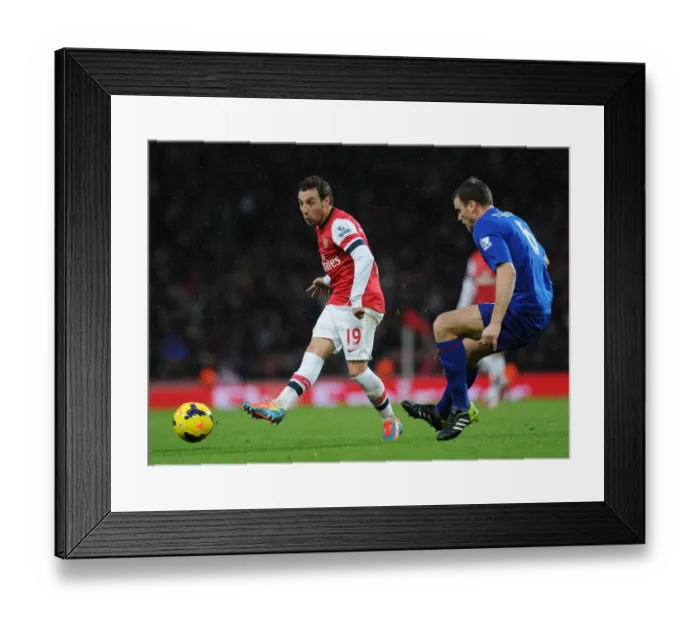 Framed Print : Santi Cazorla Drives Past Ben Turner: Arsenal vs. Cardiff City, Premier League Framed Print : Santi Cazorla Drives Past Ben Turner: Arsenal vs. Cardiff City, Premier League