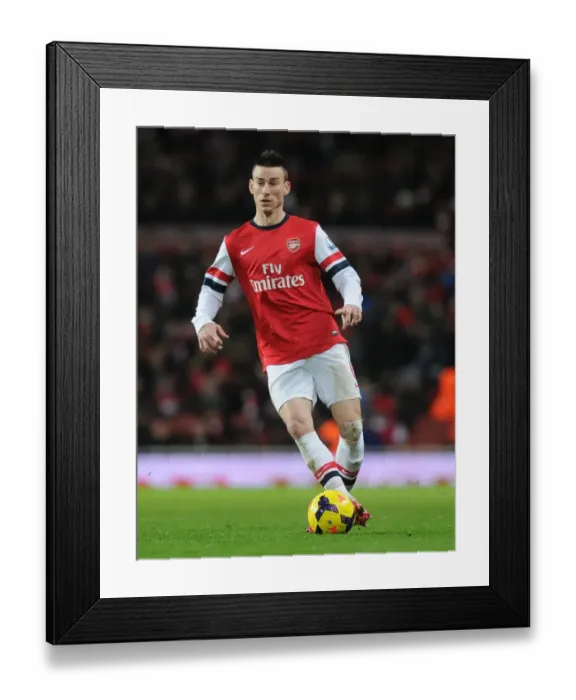 Framed Print : Arsenal's Laurent Koscielny in Action Against Cardiff City (2013-14) Framed Print : Arsenal's Laurent Koscielny in Action Against Cardiff City (2013-14)