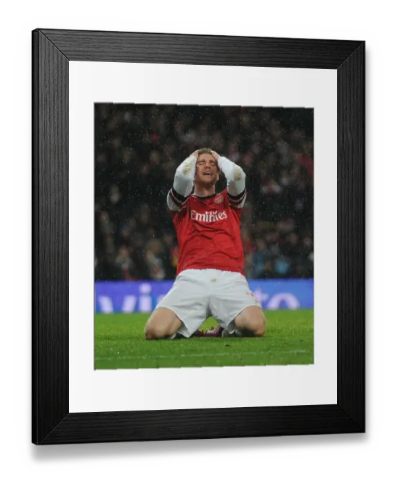 Framed Print : Heartbreaking Miss: Per Mertesacker's Agonizing Header at Arsenal vs. Cardiff City