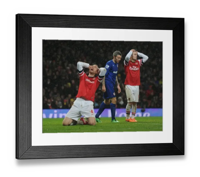 Framed Print : Heartbreaking Miss: Per Mertesacker's Agonizing Header at Arsenal vs. Cardiff City