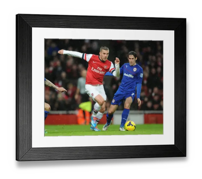 Framed Print : Arsenal's Lukas Podolski Faces Off Against Cardiff's Peter Whittingham in Premier League Clash Framed Print : Arsenal's Lukas Podolski Faces Off Against Cardiff's Peter Whittingham in Premier League Clash