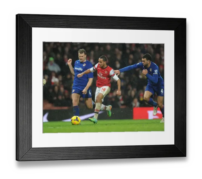 Framed Print : Theo Walcott Scores Past Ben Turner and Steven Caulker: Arsenal vs Cardiff City, Premier League 2013-14 Framed Print : Theo Walcott Scores Past Ben Turner and Steven Caulker: Arsenal vs Cardiff City, Premier League 2013-14