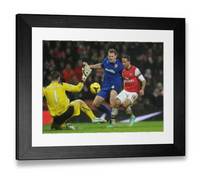Framed Print : Theo Walcott Scores Chip Over David Marshall: Arsenal vs. Cardiff City, Premier League 2013-14