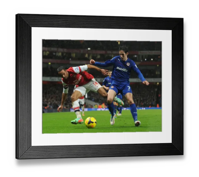 Framed Print : Theo Walcott vs. Peter Whittingham: Intense Battle at the Emirates - Arsenal v Cardiff City, Premier League