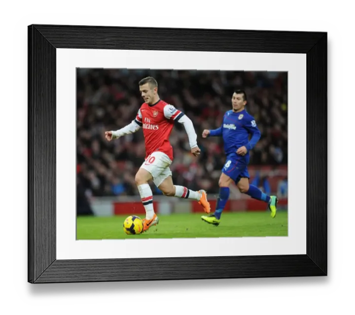 Framed Print : Jack Wilshere vs. Gary Medel: Intense Battle in Arsenal v Cardiff City Premier League Clash