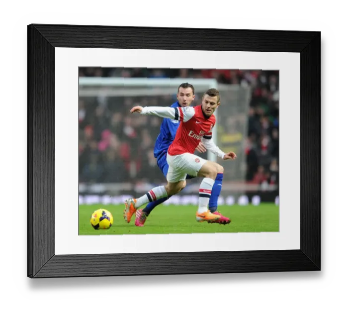 Framed Print : Jack Wilshere vs Jordan Mutch: Intense Battle in Arsenal v Cardiff City Premier League Clash