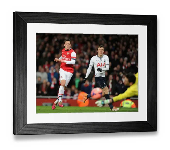 Framed Print : Mesut Ozil vs Vlad Chiriches: Intense Shootout at Arsenal v Tottenham FA Cup Match Framed Print : Mesut Ozil vs Vlad Chiriches: Intense Shootout at Arsenal v Tottenham FA Cup Match