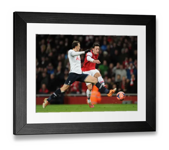 Framed Print : Mesut Ozil vs Vlad Chiriches: A Shooting Duel at the Arsenal vs Tottenham FA Cup Match Framed Print : Mesut Ozil vs Vlad Chiriches: A Shooting Duel at the Arsenal vs Tottenham FA Cup Match