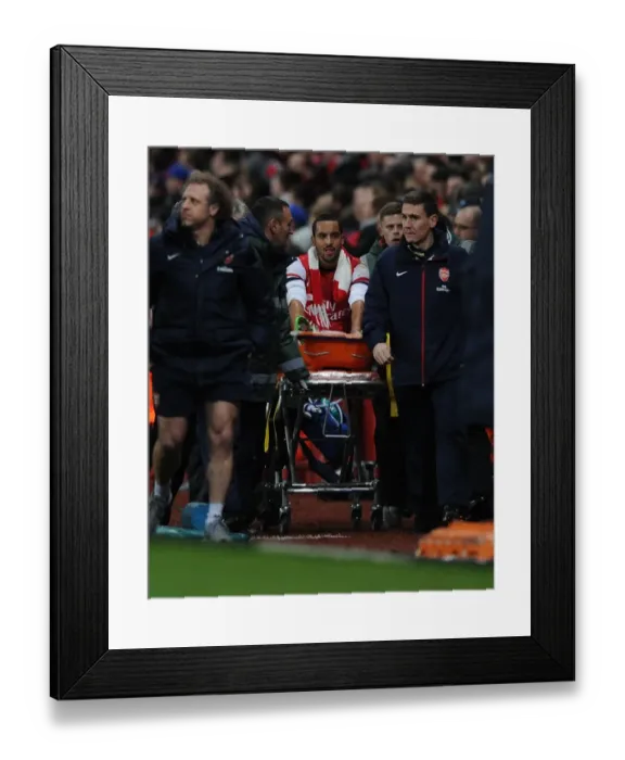 Framed Print : Theo Walcott's Injury Marrs Arsenal in FA Cup Clash Against Tottenham