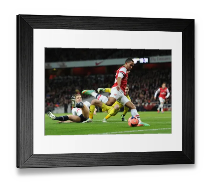 Framed Print : Theo Walcott (Arsenal) Michael Dawson and Hugo Lloris (Tottenham). Arsenal 2: 0 Tottenham Hotspur Framed Print : Theo Walcott (Arsenal) Michael Dawson and Hugo Lloris (Tottenham). Arsenal 2: 0 Tottenham Hotspur