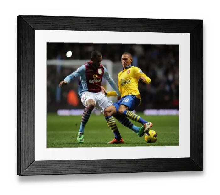 Framed Print : Arsenal's Kieran Gibbs Fends Off Aston Villa's Leandro Bacuna During Premier League Clash Framed Print : Arsenal's Kieran Gibbs Fends Off Aston Villa's Leandro Bacuna During Premier League Clash
