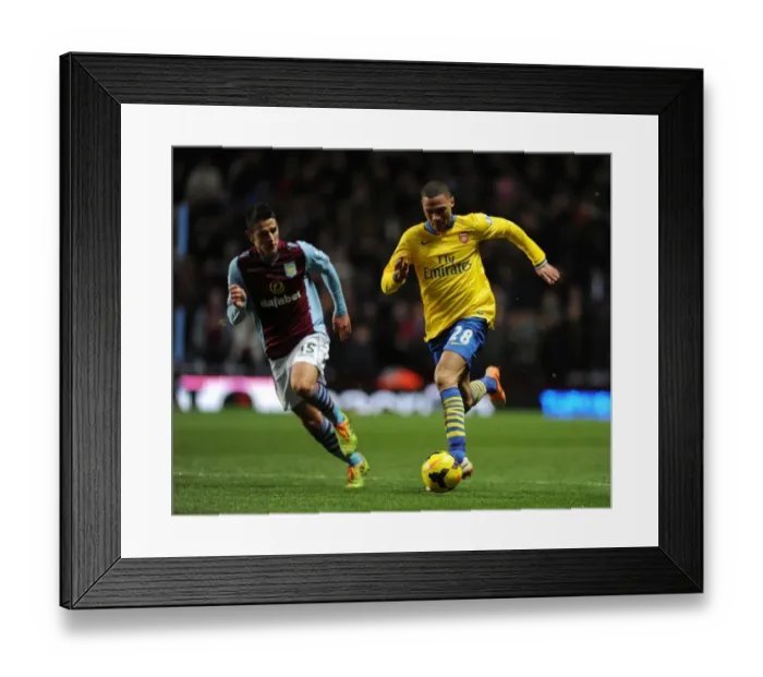 Framed Print : Arsenal's Kieran Gibbs Faces Off Against Aston Villa's Ashley Westwood in Premier League Clash Framed Print : Arsenal's Kieran Gibbs Faces Off Against Aston Villa's Ashley Westwood in Premier League Clash