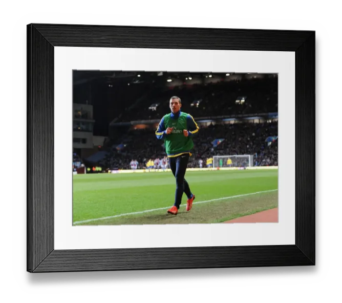 Framed Print : Arsenal's Lukas Podolski Warming Up Ahead of Aston Villa Clash, 2014 Premier League