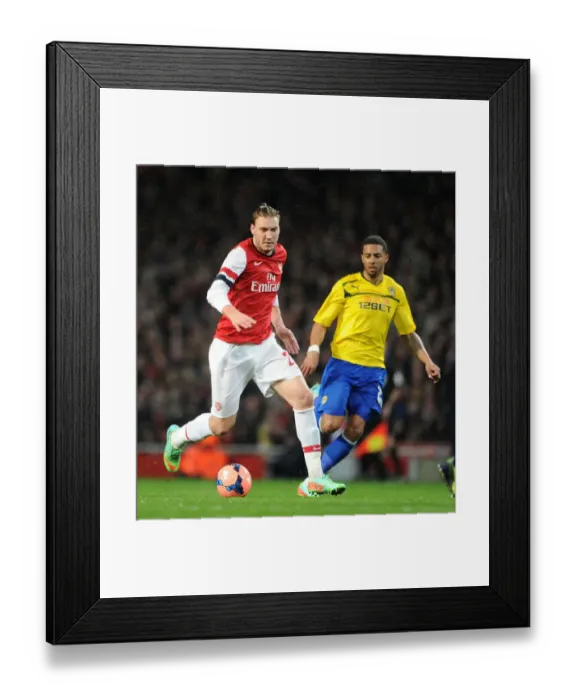 Framed Print : Arsenal's Nicklas Bendtner Outruns Coventry's Cyrus Christie in FA Cup Clash Framed Print : Arsenal's Nicklas Bendtner Outruns Coventry's Cyrus Christie in FA Cup Clash