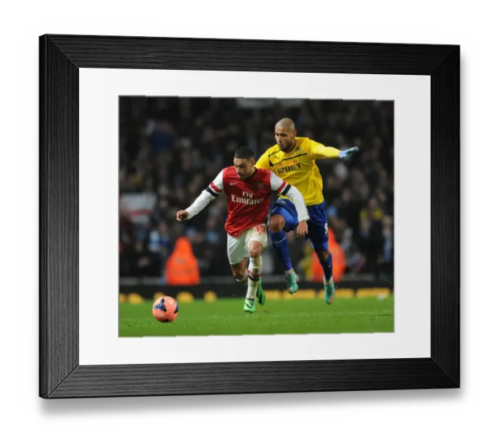 Framed Print : Alex Oxlade-Chamberlain Outpaces Leon Clarke in FA Cup Fourth Round Clash Framed Print : Alex Oxlade-Chamberlain Outpaces Leon Clarke in FA Cup Fourth Round Clash