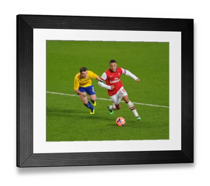 Framed Print : Arsenal's Alex Oxlade-Chamberlain Faces Off Against Coventry's John Fleck in FA Cup Fourth Round Clash