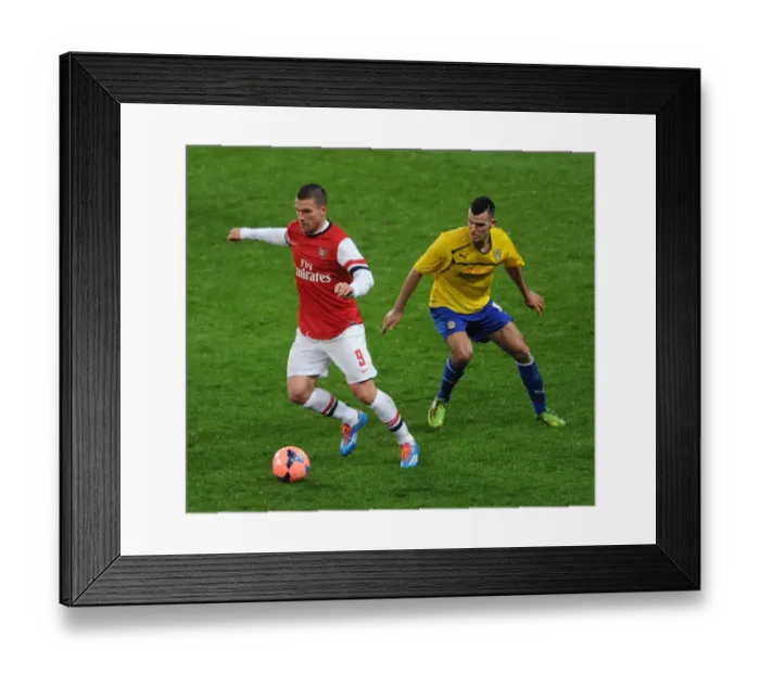 Framed Print : Arsenal's Lukas Podolski Outruns Coventry's Conor Thomas in FA Cup Fourth Round Clash Framed Print : Arsenal's Lukas Podolski Outruns Coventry's Conor Thomas in FA Cup Fourth Round Clash