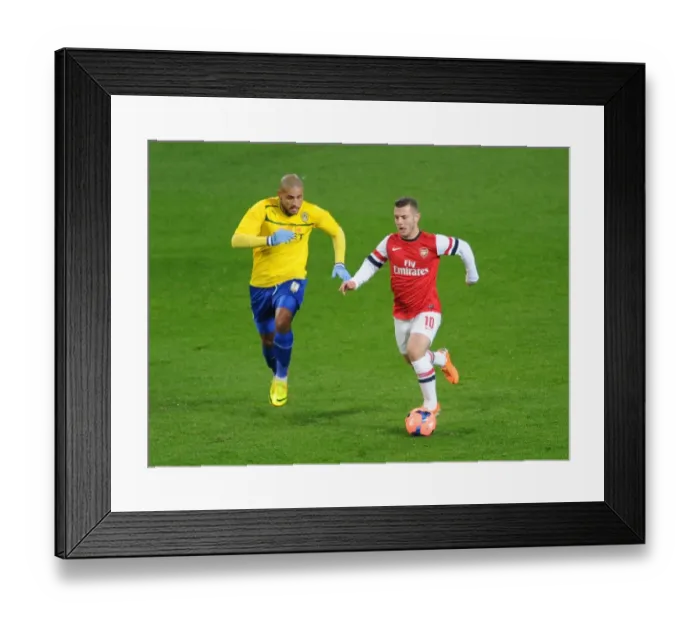Framed Print : Jack Wilshere Outpaces Leon Clarke in FA Cup Fourth Round Clash between Arsenal and Coventry City Framed Print : Jack Wilshere Outpaces Leon Clarke in FA Cup Fourth Round Clash between Arsenal and Coventry City