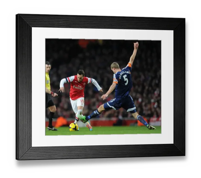 Framed Print : Arsenal's Santi Cazorla Clashes with Fulham's Brede Hangeland during the Premier League Match Framed Print : Arsenal's Santi Cazorla Clashes with Fulham's Brede Hangeland during the Premier League Match