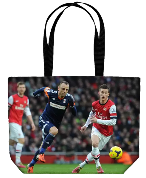 Laurent Koscielny (Arsenal) Dimitar Berbatov (Fulham). Arsenal 2: 0 Fulham. Barclays Premier League