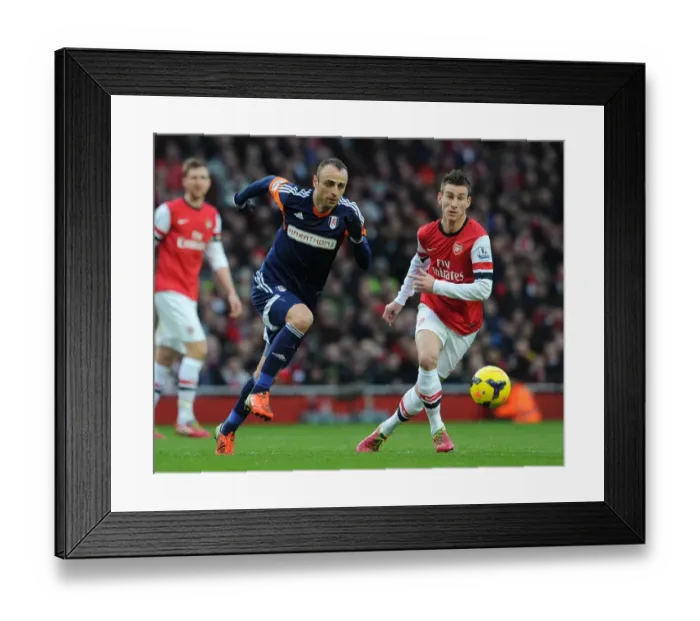 Framed Print : Laurent Koscielny (Arsenal) Dimitar Berbatov (Fulham). Arsenal 2: 0 Fulham. Barclays Premier League