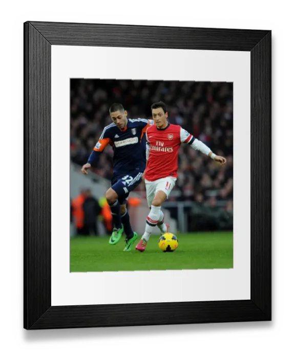 Framed Print : Mesut Ozil vs. Clint Dempsey: A Battle at the Emirates - Arsenal v Fulham, Premier League 2013-14 Framed Print : Mesut Ozil vs. Clint Dempsey: A Battle at the Emirates - Arsenal v Fulham, Premier League 2013-14