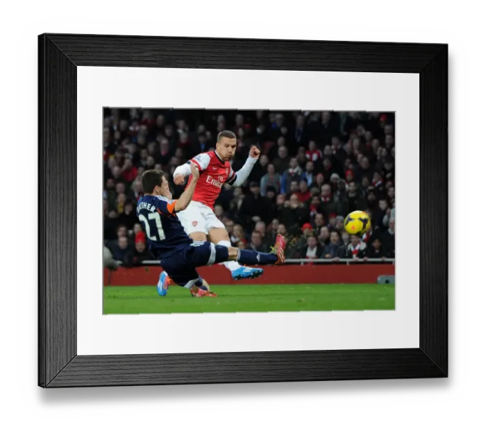 Framed Print : Podolski vs. Riether: Intense Moment at Arsenal v Fulham, Premier League Framed Print : Podolski vs. Riether: Intense Moment at Arsenal v Fulham, Premier League
