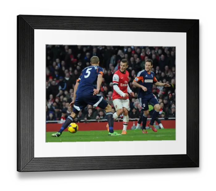 Framed Print : Jack Wilshere (Arsenal) passes for Santi Cazorlas 1st goal under pressure from Brede Hangeland