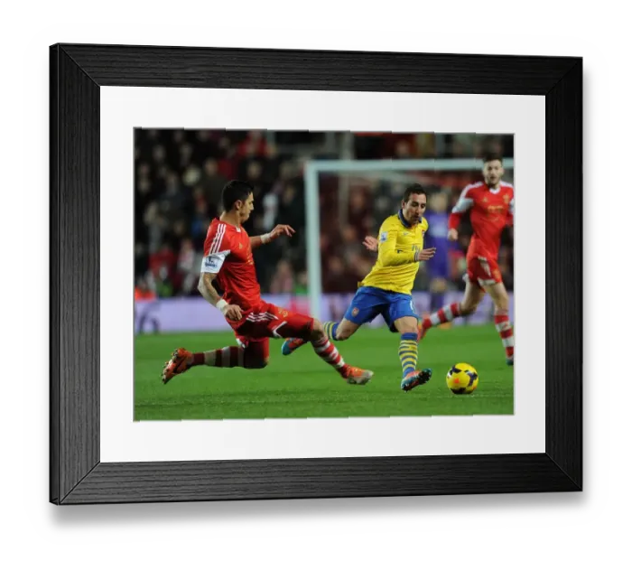 Framed Print : Santi Cazorla vs Jose Fonte: Intense Battle in Southampton vs Arsenal Premier League Clash