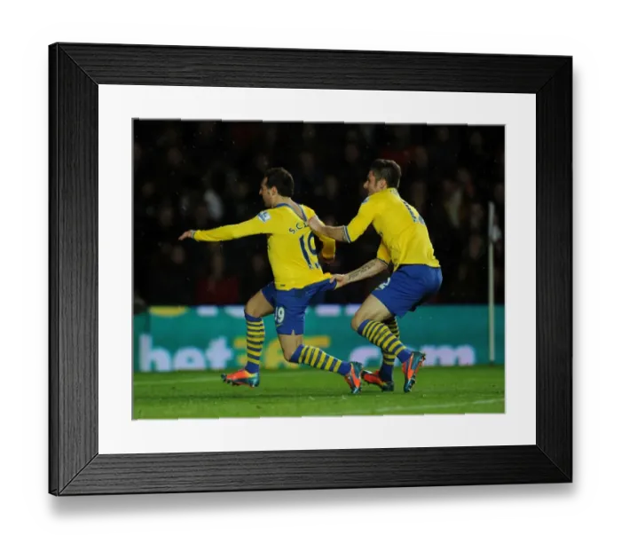 Framed Print : Cazorla and Giroud Celebrate Arsenal's Winning Goals Against Southampton (2013-14) Framed Print : Cazorla and Giroud Celebrate Arsenal's Winning Goals Against Southampton (2013-14)