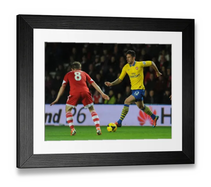 Framed Print : Olivier Giroud vs. Steven Davis: Intense Battle in Southampton v Arsenal Premier League Clash Framed Print : Olivier Giroud vs. Steven Davis: Intense Battle in Southampton v Arsenal Premier League Clash