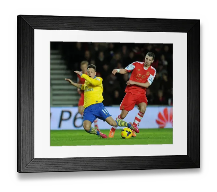 Framed Print : Clash of Midfield Maestros: Ozil vs. Schneiderlin, Southampton vs. Arsenal, Premier League 2013-14 Framed Print : Clash of Midfield Maestros: Ozil vs. Schneiderlin, Southampton vs. Arsenal, Premier League 2013-14
