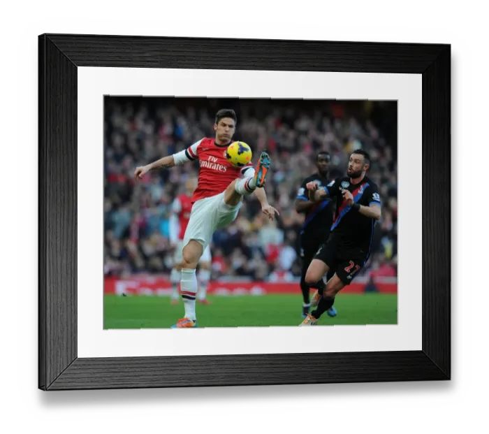 Framed Print : Arsenal's Olivier Giroud Fends Off Crystal Palace's Damien Delaney During Premier League Clash Framed Print : Arsenal's Olivier Giroud Fends Off Crystal Palace's Damien Delaney During Premier League Clash