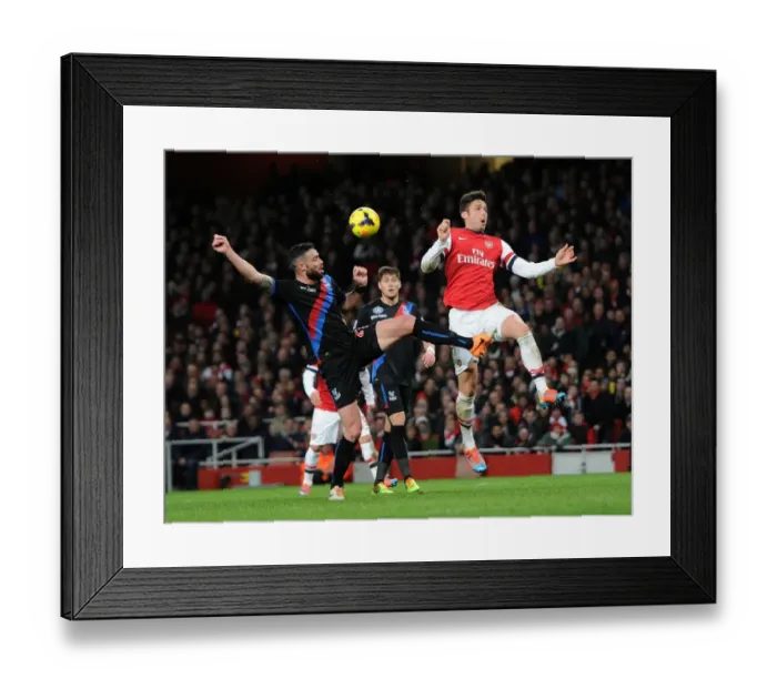 Framed Print : Clash at Emirates: Giroud vs. Delaney - Arsenal vs. Crystal Palace, Premier League 2013-14