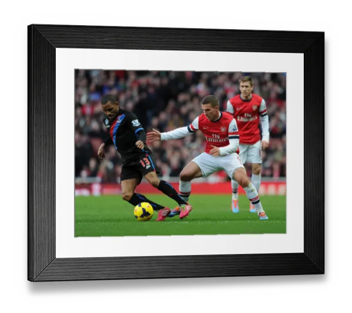 Framed Print : Lukas Podolski (Arsenal) Jason Puncheon (Palace). Arsenal 2: 0 Crystal Palace. Barclays