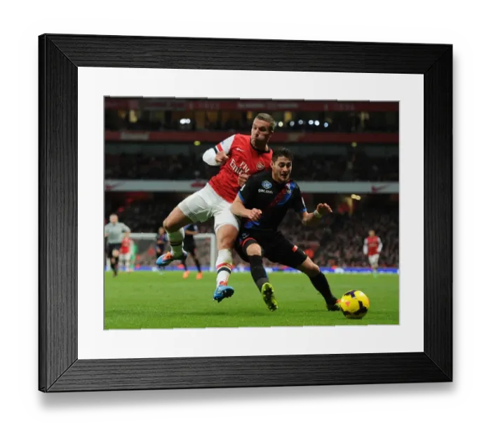 Framed Print : Arsenal's Lukas Podolski Faces Off Against Crystal Palace's Joel Ward in Premier League Showdown
