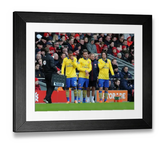 Framed Print : Kieran Gibbs, Lukas Podolski and Tomas Rosicky (Arsenal) prepare to come on as substitutes Framed Print : Kieran Gibbs, Lukas Podolski and Tomas Rosicky (Arsenal) prepare to come on as substitutes