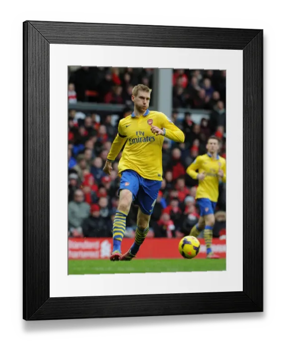 Framed Print : Per Mertesacker at Anfield: Liverpool vs Arsenal, Premier League 2013-14 Framed Print : Per Mertesacker at Anfield: Liverpool vs Arsenal, Premier League 2013-14