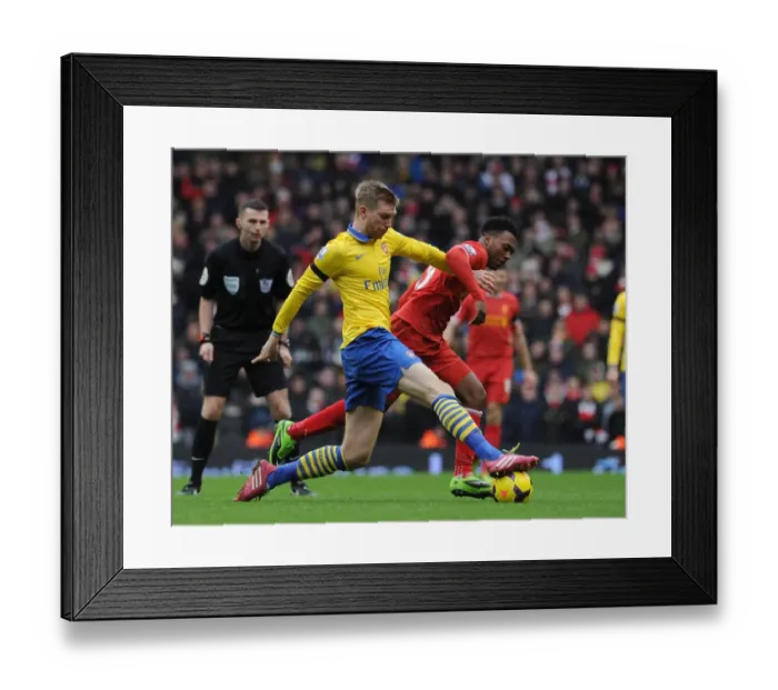 Framed Print : Intense Battle: Per Mertesacker vs. Daniel Sturridge, Premier League 2013-14 - Arsenal's Defender Tackles Liverpool's Striker Framed Print : Intense Battle: Per Mertesacker vs. Daniel Sturridge, Premier League 2013-14 - Arsenal's Defender Tackles Liverpool's Striker