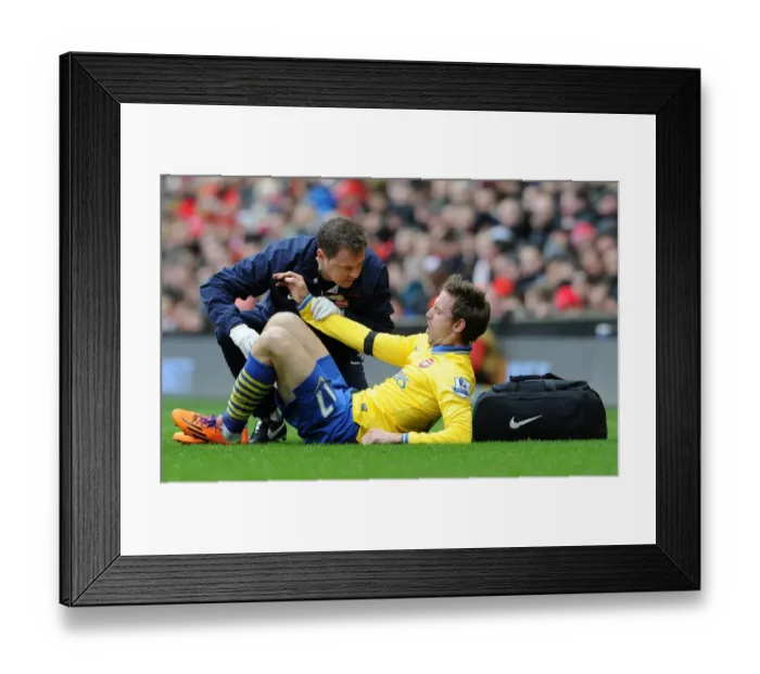 Framed Print : Nacho Monreal Receives Treatment from Arsenal Physio during Liverpool vs Arsenal Match (2014) Framed Print : Nacho Monreal Receives Treatment from Arsenal Physio during Liverpool vs Arsenal Match (2014)