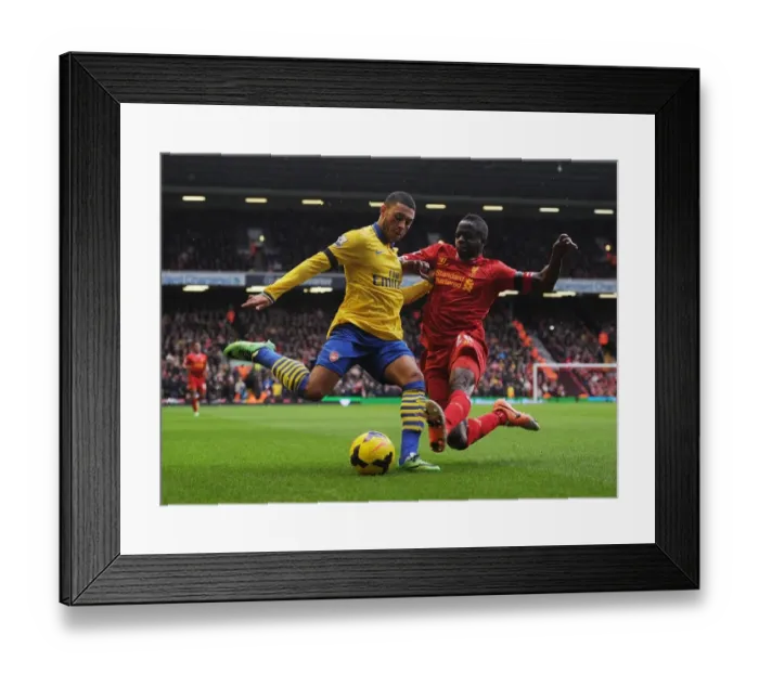 Framed Print : Clash at Anfield: Oxlade-Chamberlain vs. Cissokho