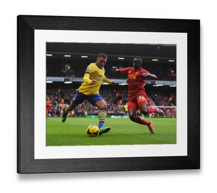 Framed Print : Clash at Anfield: Oxlade-Chamberlain vs. Cissokho in the Premier League Battle