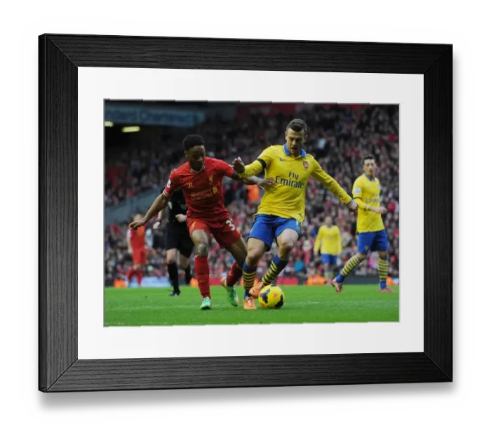Framed Print : Clash of Stars: Wilshere vs Sterling - Liverpool vs Arsenal, Premier League 2013-14 Framed Print : Clash of Stars: Wilshere vs Sterling - Liverpool vs Arsenal, Premier League 2013-14