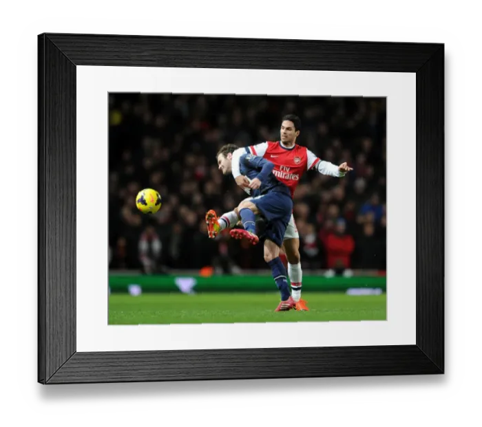 Framed Print : Mikel Arteta vs Juan Mata: Clash of Midfield Maestros in Arsenal vs Manchester United (2013-14)